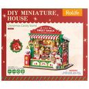 Vorderseite der Verpackung der Robotime Christmas Candy Stand, Bausatz für einen Miniatur-Süßigkeitenstand im Weihnachtsdesign