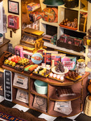 Nahaufnahme der Theke und der Leckereien im Robotime Henry's Chocolate