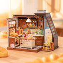 Atmosphärische Präsentation der Robotime Baking Kitchen, Miniaturhaus einer altmodischen Küche, in der Brot und Gebäck gebacken wird