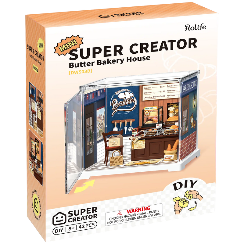 Vorderseite der Verpackung der Robotime Butter Bakery House, Miniatur- Bäckerei aus Kunststoff in einer kleinen Vitrine