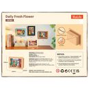 Rückseite der Verpackung der Robotime  Daily Fresh Flower, Diorama in einem Rahmen eines altmodischen Ladens mit Blumen und Pflanzen