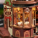 Die Maschine, die unten im Turm der Robotime Dream Coffee Factory Kaffeetassen befüllt
