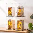 Vier übereinander gestapelte Book Nooks in Robotime Dust Covers WD1001