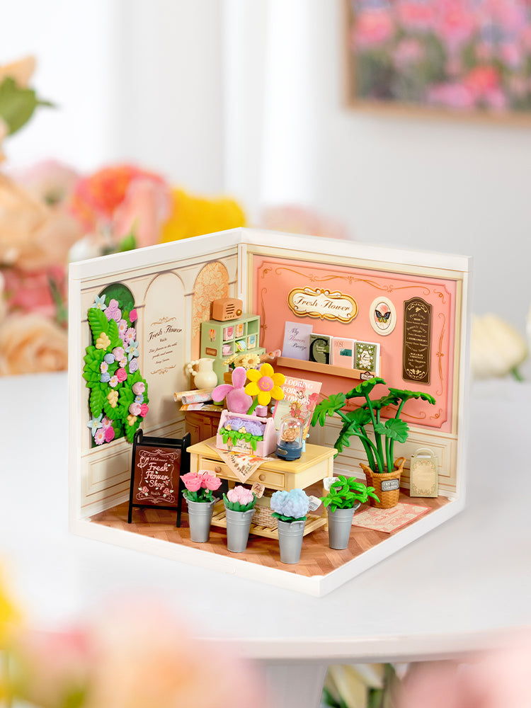 Atmosphärische Präsentation der Robotime Fresh Flower Shop, Kunststoff-Miniaturhaus eines gemütlichen Blumenladens