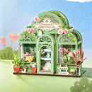 Atmosphärische Präsentation der Robotime Green Fountain Garden, Bausatz für ein Miniaturhaus eines Blumenladens in einem eleganten Gewächshaus