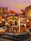 Atmosphärische Präsentation der Robotime Henry’s Chocolate, Miniaturhaus eines altmodischen Schokoladengeschäfts