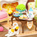 Der gedeckte Tisch am Kamin und die Katze, die sich in der Robotime Holiday Tea Time streckt