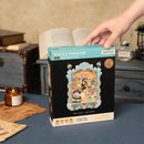 Stimmungsvolle Präsentation der Verpackung von Robotime Magic Kitty’s Home