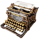 Produktfoto der Robotime Mechanical Typewriter (Classic Version), Holzbausatz einer funktionsfähigen Schreibmaschine in Schwarz und Gold