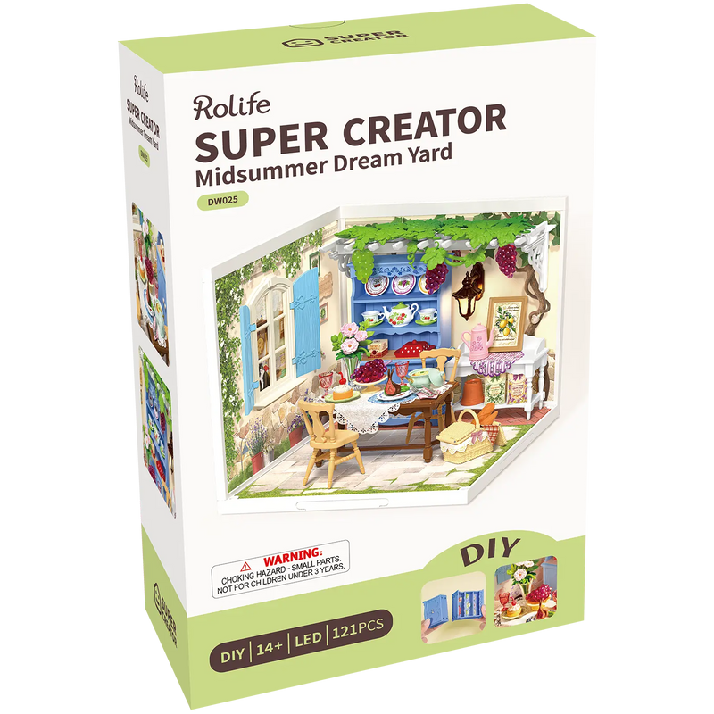 Vorderseite der Verpackung der Robotime Midsummer Dream Yard, Kunststoff-Miniaturterrasse mit gedecktem Tisch, Pergola und Möbeln