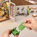 Eine Person baut den Stuhl des Robotime Secret Bloomy Nook zusammen