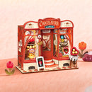 Atmosphärische Präsentation der Robotime Sweet Chocolate Shop, Bausatz für ein Miniaturhaus einer altmodischen Schokoladenboutique