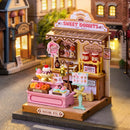 Atmosphärische Präsentation der Robotime Sweetie's Donut Shop, Miniaturhaus eines kleinen Ladens mit Donuts und anderem Gebäck