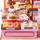 Donuts und anderes Gebäck, ausgestellt im Robotime Sweetie's Donut Shop