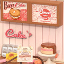 Details der Werbung, eine Torte und Requisiten in der Robotime Tasty Cake Shop