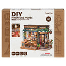 Vorderseite der Verpackung der Robotime Tipsy Restaurant, gemütliches Miniatur-Restaurant im altmodischen Stil