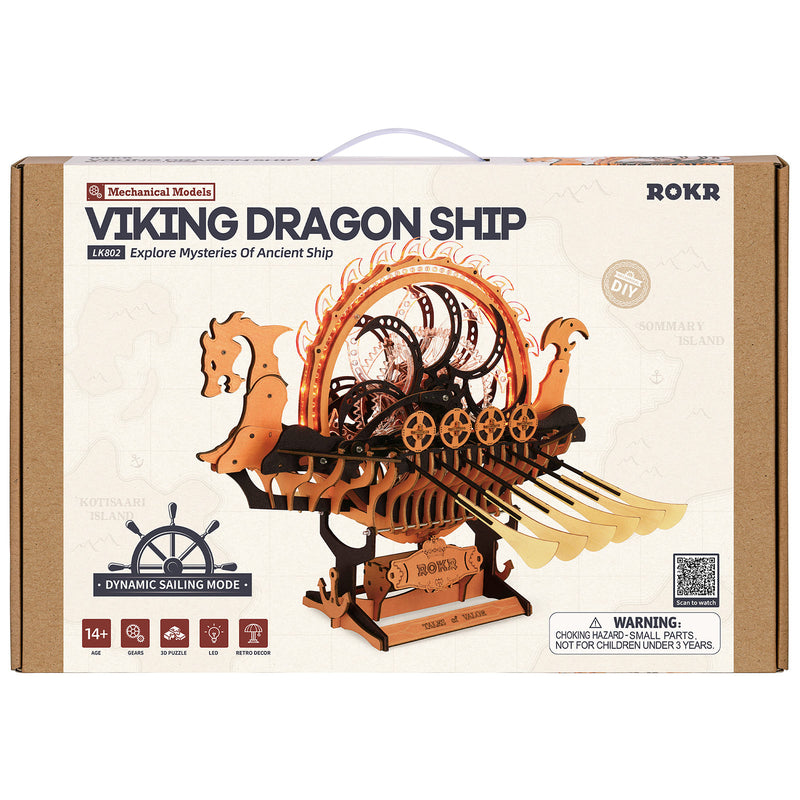 Vorderseite der Verpackung der Robotime Viking Dragon Ship, Holzbausatz eines Wikingerschiffs mit beweglichen Rudern und leuchtendem Rad auf dem Deck