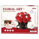 Vorderseite der Verpackung der Rolife Red Rose Bouquet, Kunststoff-Bausatz für einen Strauß roter Rosen und weißer Gänseblümchen in einer schwarzen Vase mit schwarzem Band darum